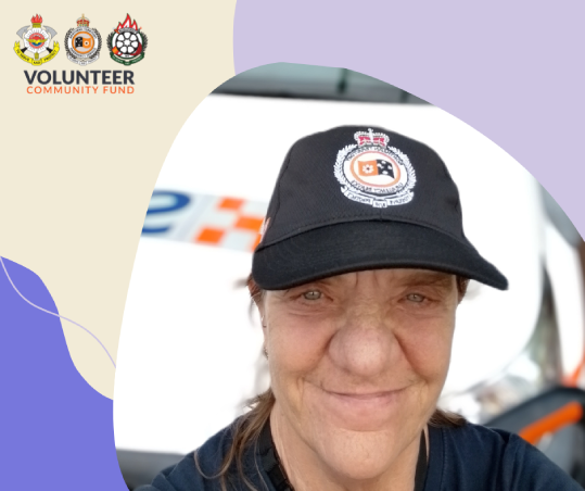 Vicki Simlesa, NT Emergency Services volunteer - Vicki wearing and NTES cap in front of a NTES vehicle